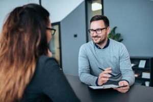 Female Person Having an Interview with a Male Recruiter for Concierge Staff